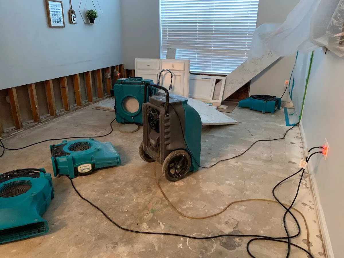 Dehumidifier in flood-cut room for Water Damage Restoration in Highland